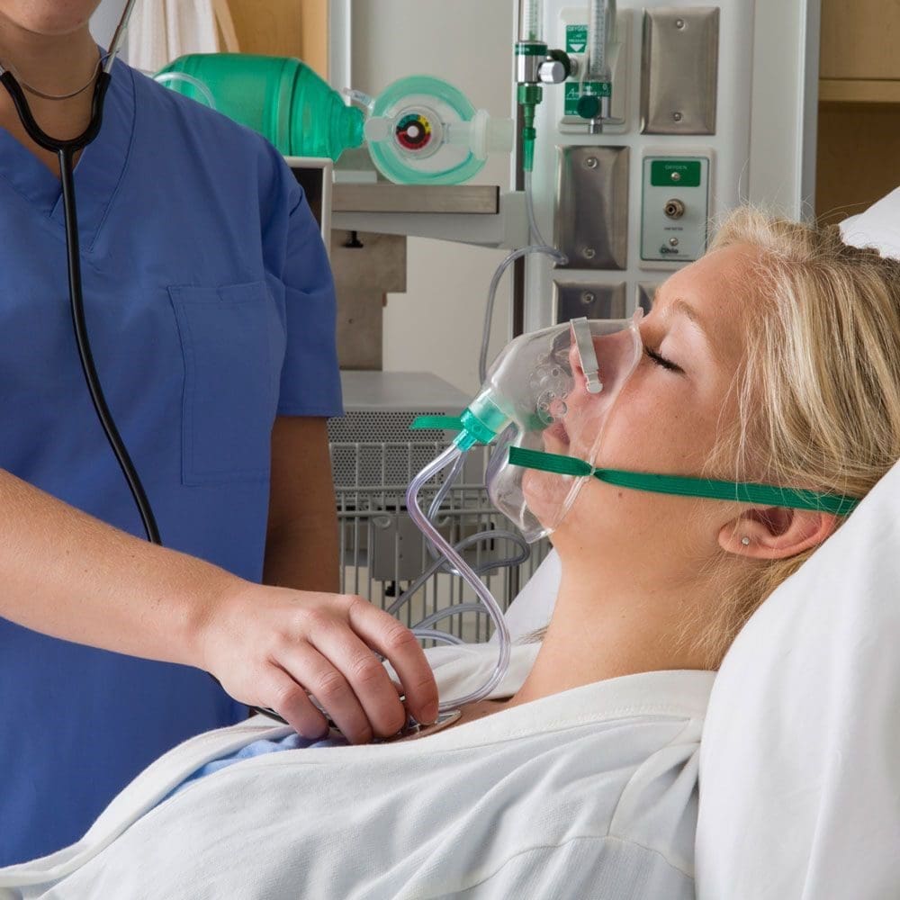 Patient breathing through mask