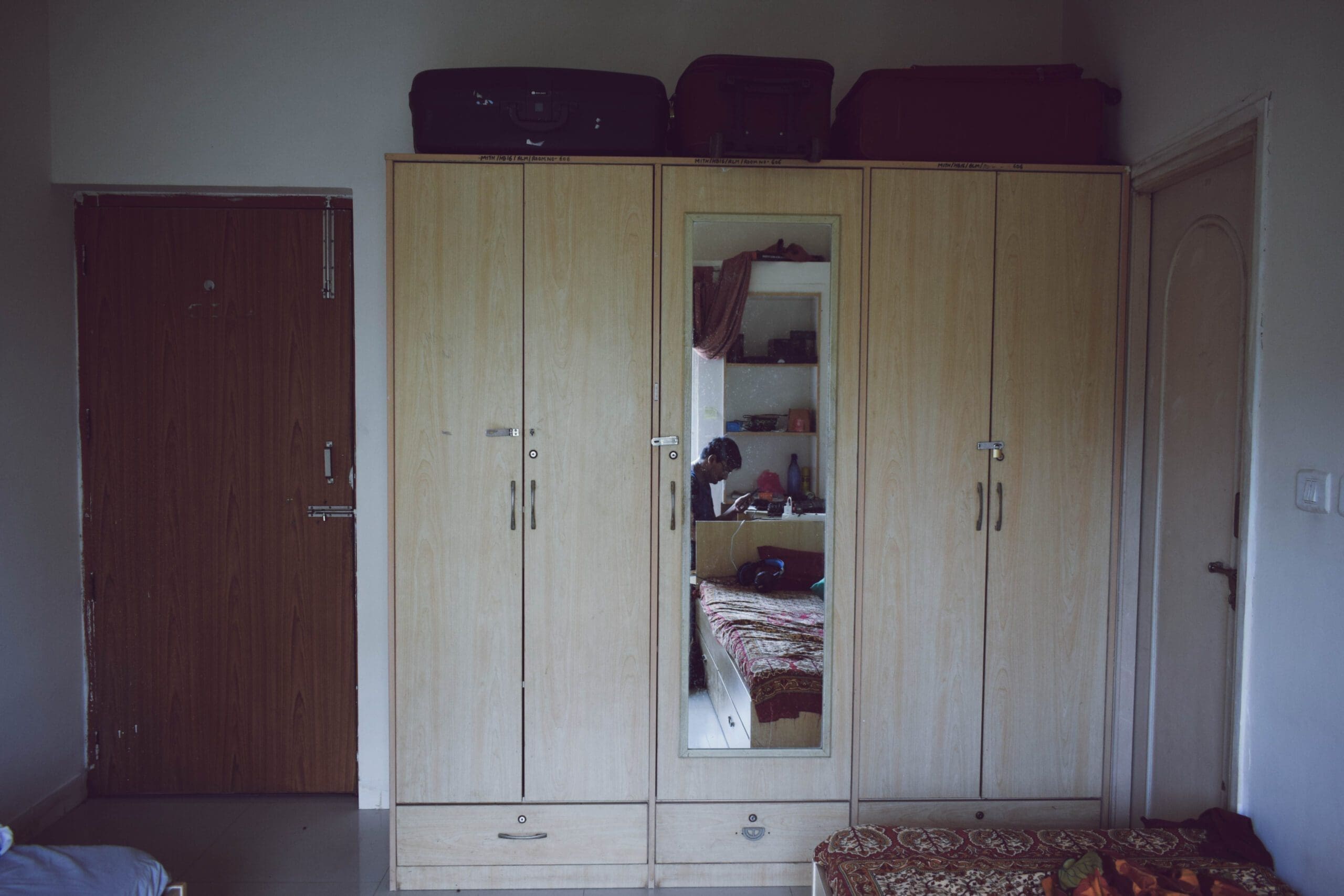 There are 3 cupboards in a 2 sharing room, one is the private one of each and 1 is common - MIT Manipal 16th Block Hostel Room Pictures