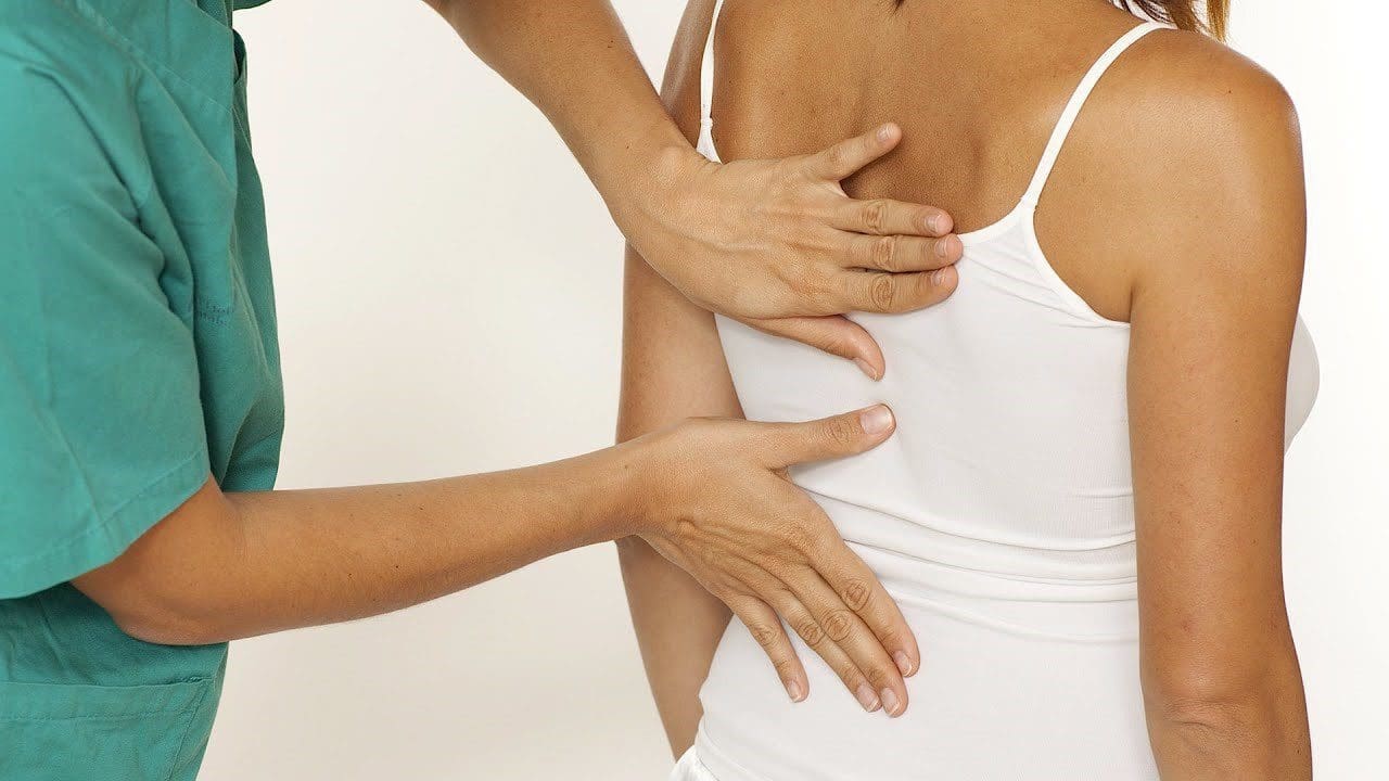 Examining Womans Back