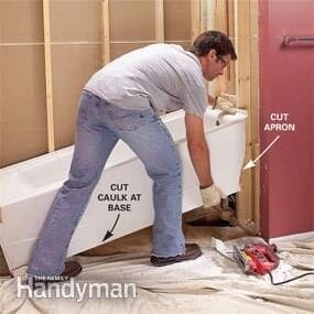 Lift the old acrylic tub