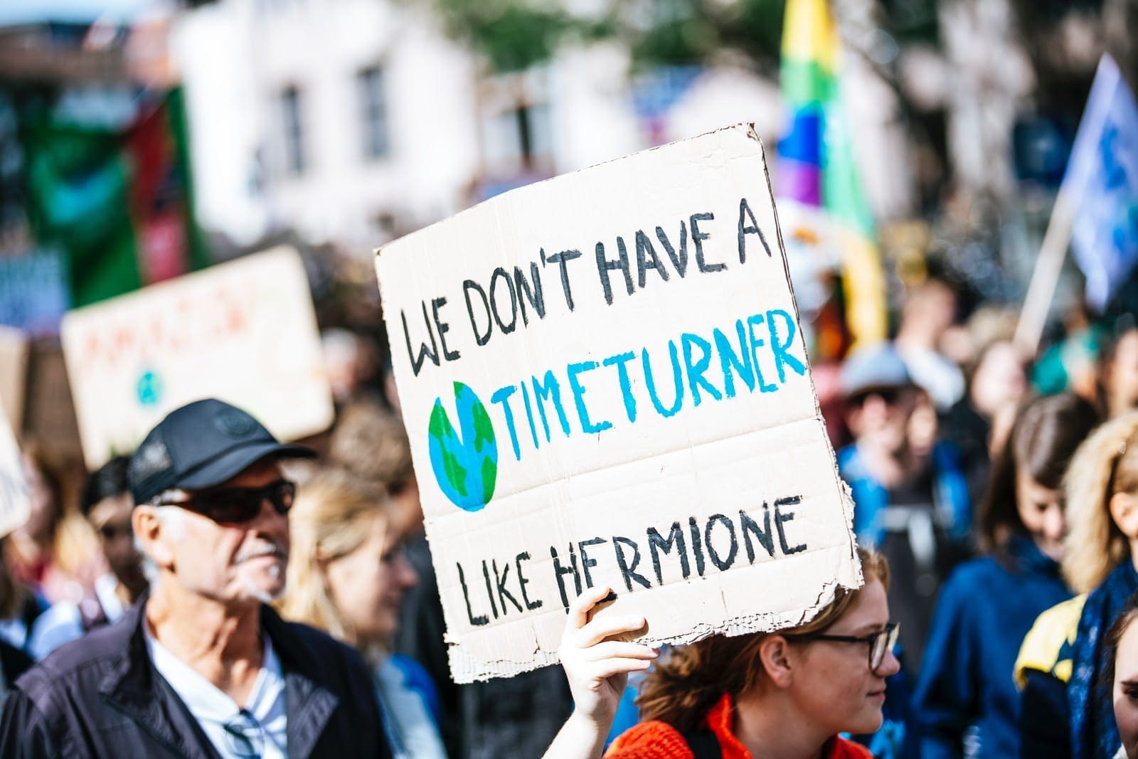 eco-crisis people holding signage during daytime