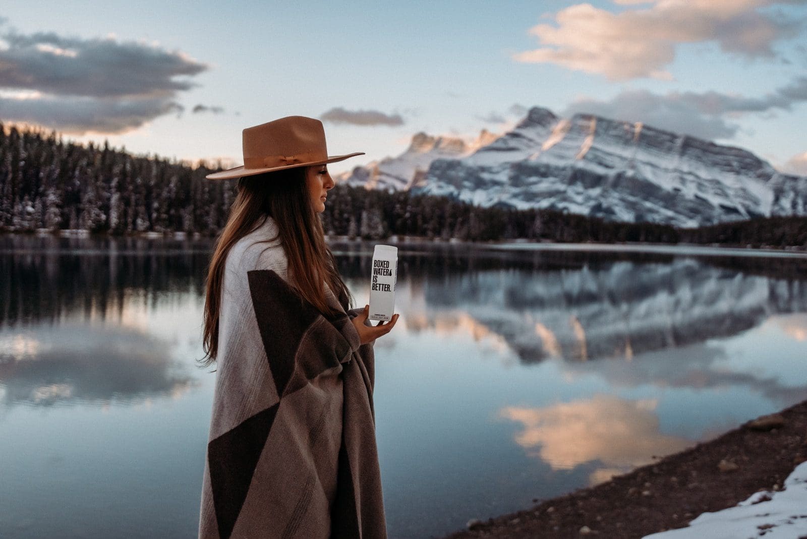 weight loss woman in brown coat wearing brown hat standing near lake during daytime