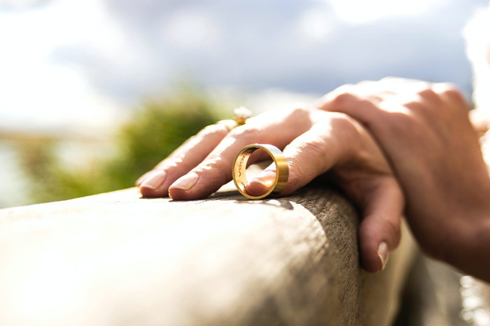 family law person holding gold wedding band