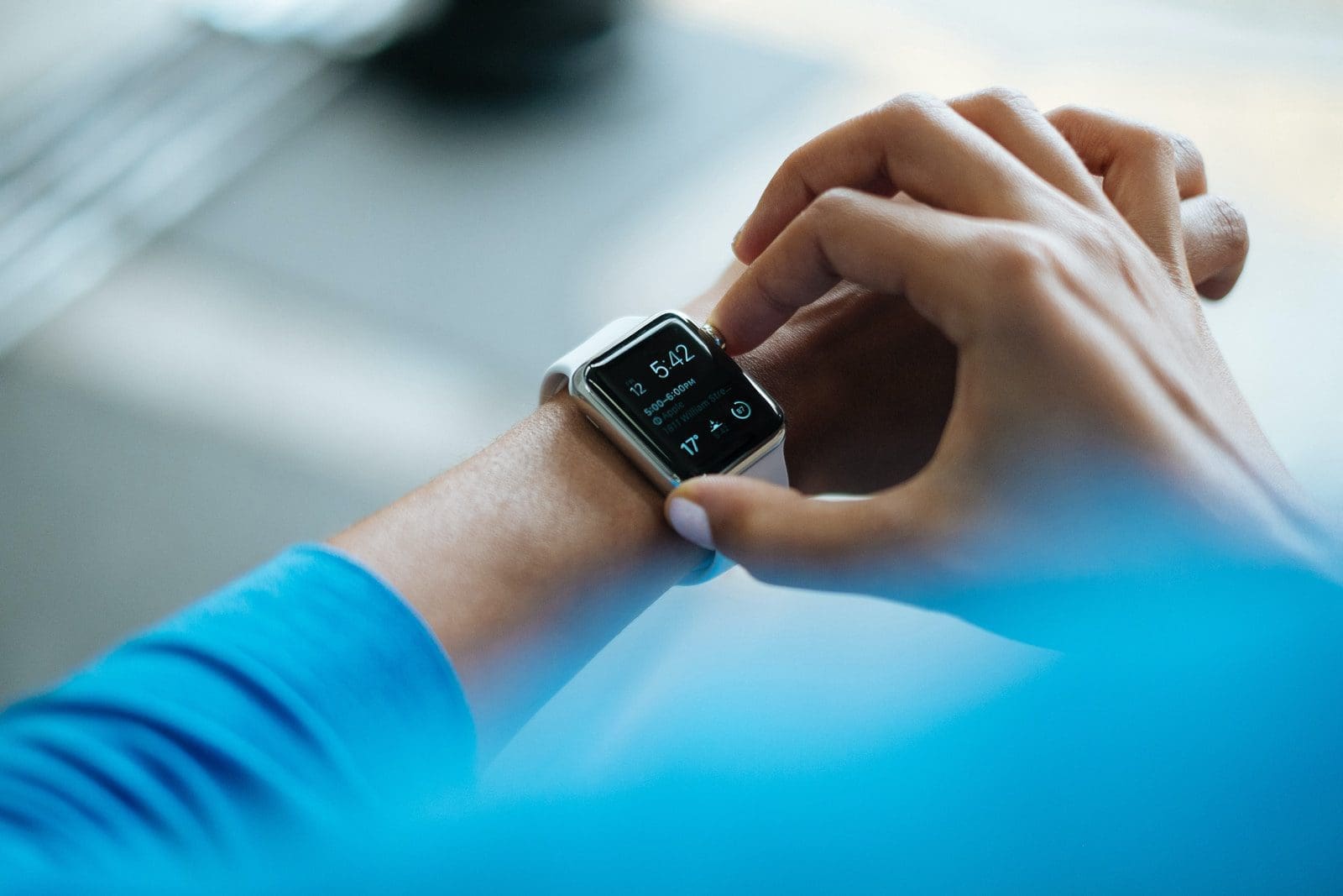 exam day person clicking Apple Watch smartwatch