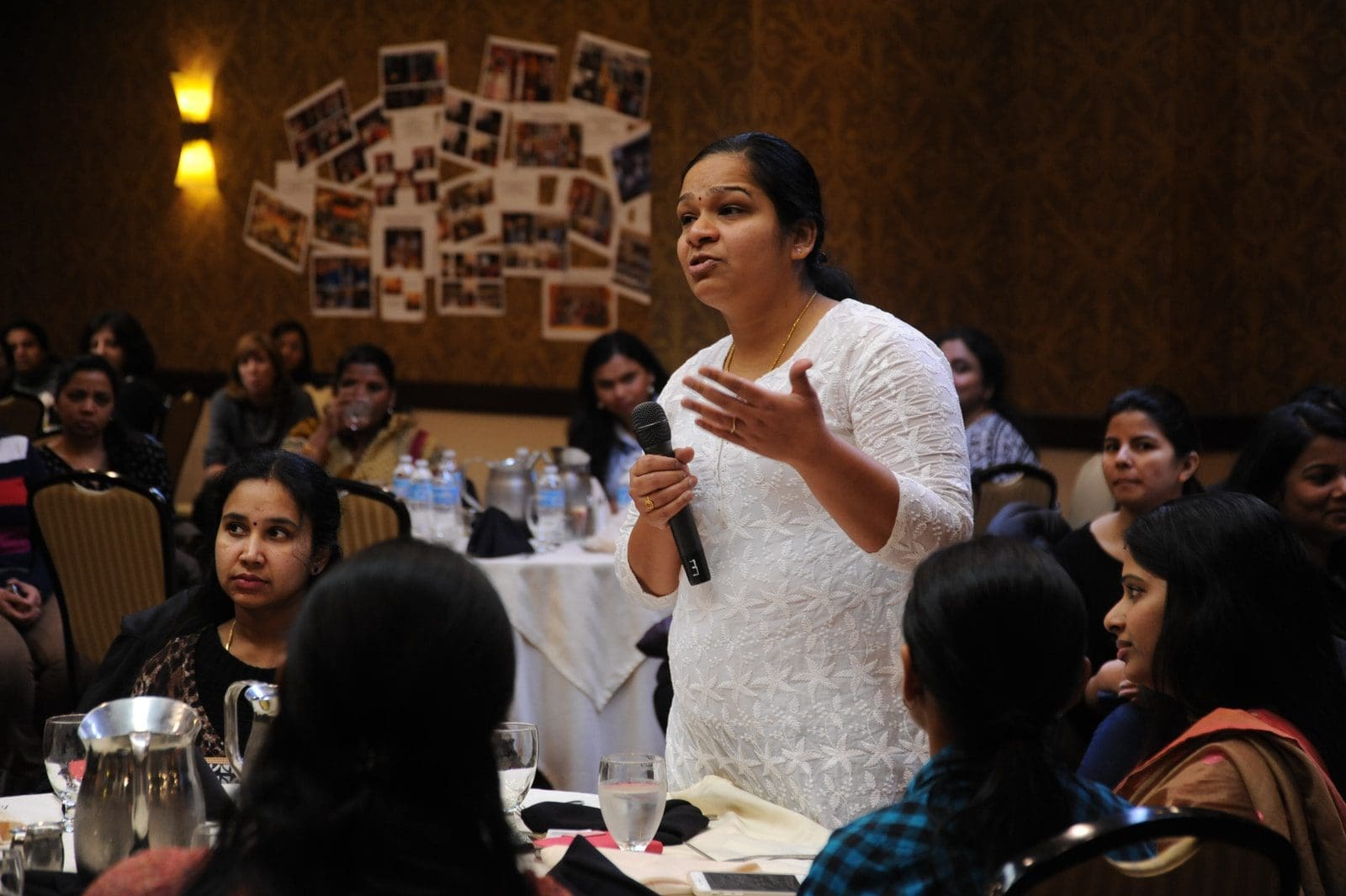 public speaking woman holding microphone