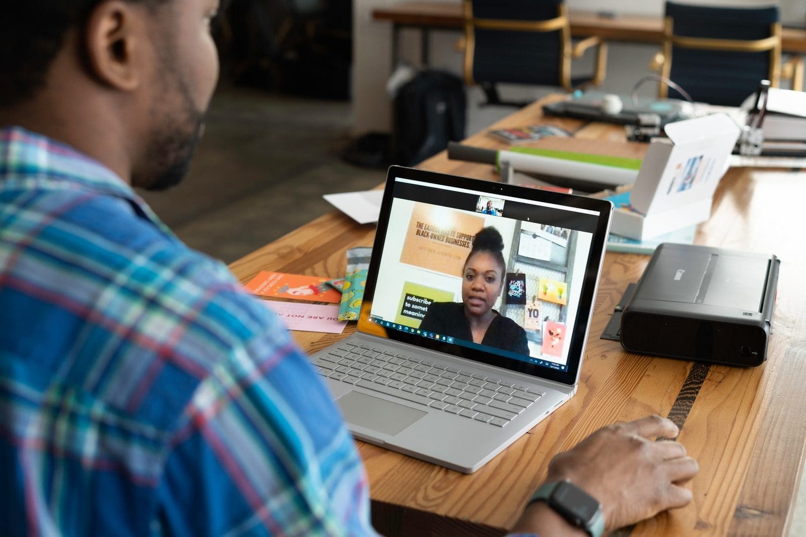 virtual background man in blue and white plaid shirt using macbook pro