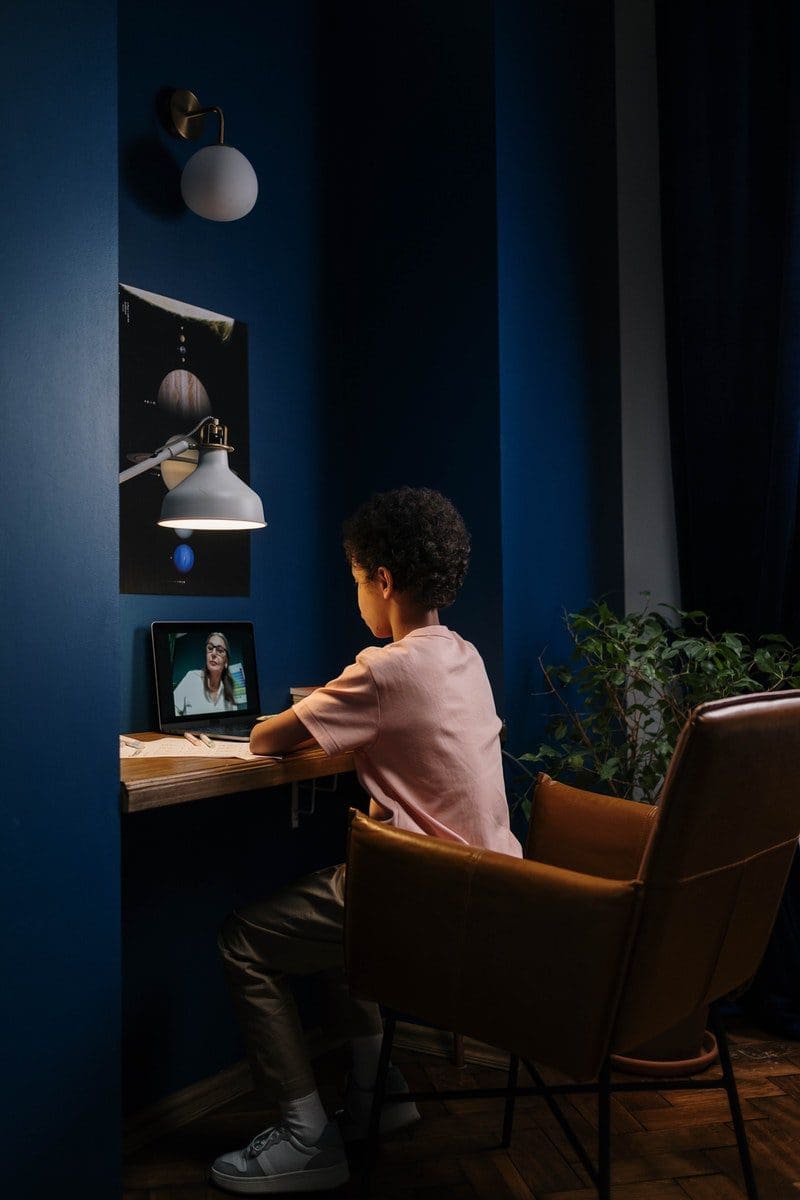 online tuition Man in White Dress Shirt Sitting on Chair