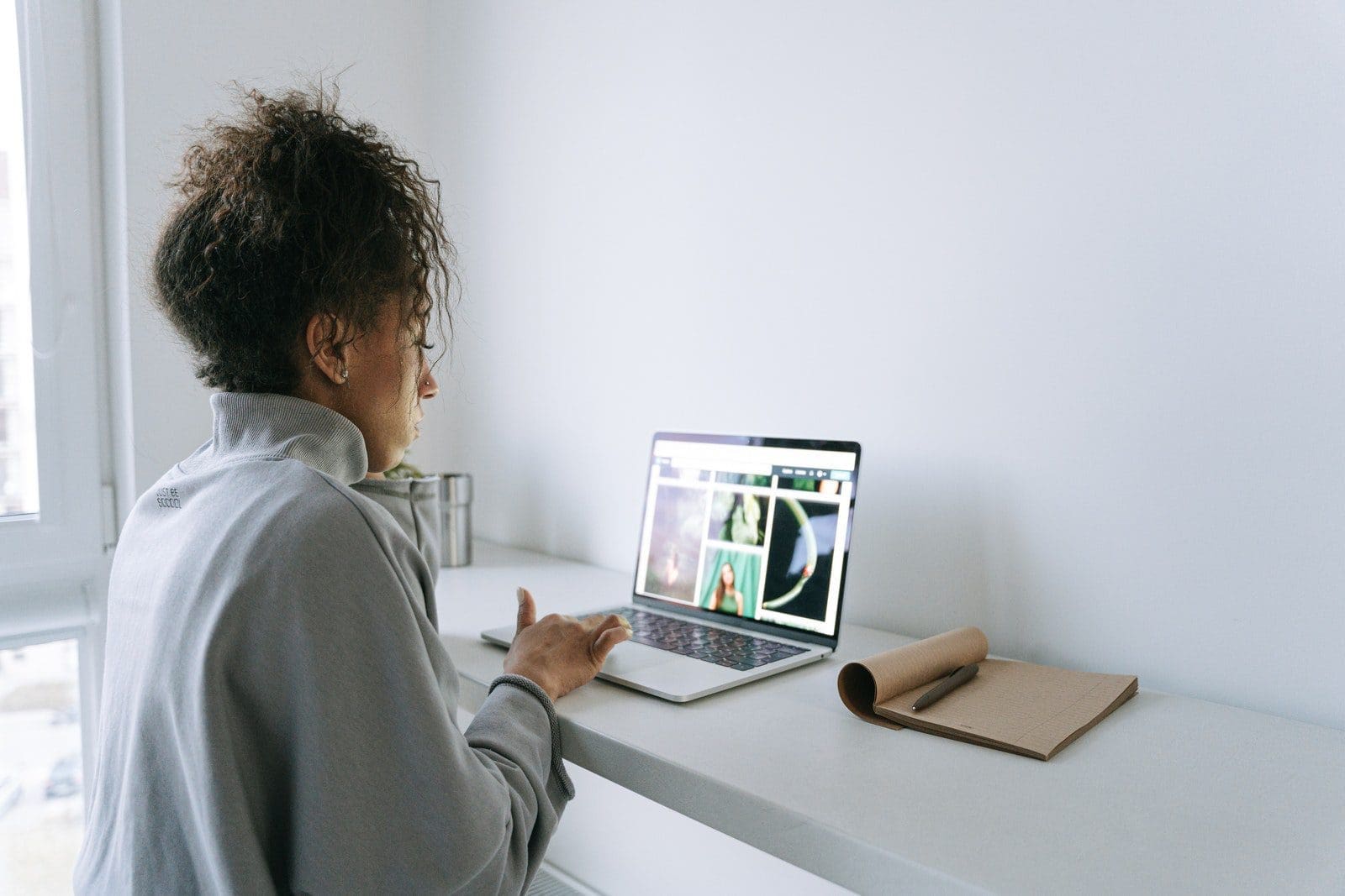 Man in Gray Sweater Using Silver Macbook Air