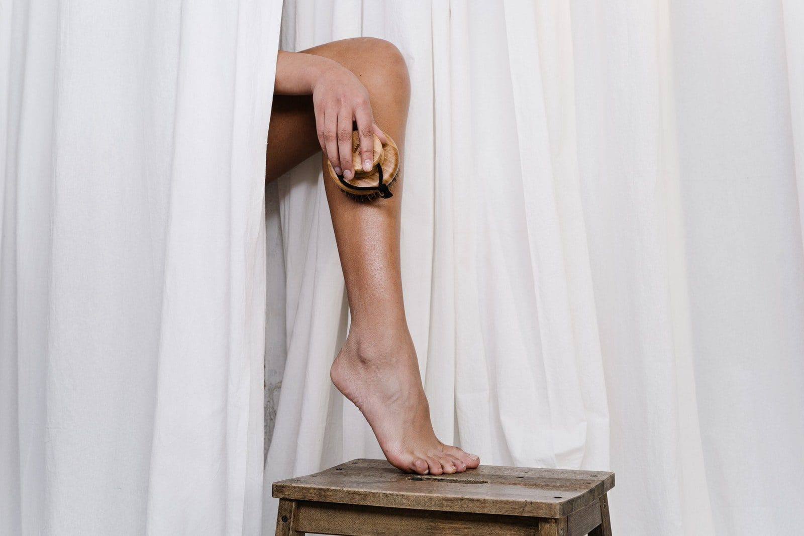 body scrub Person Scrubbing Her Leg