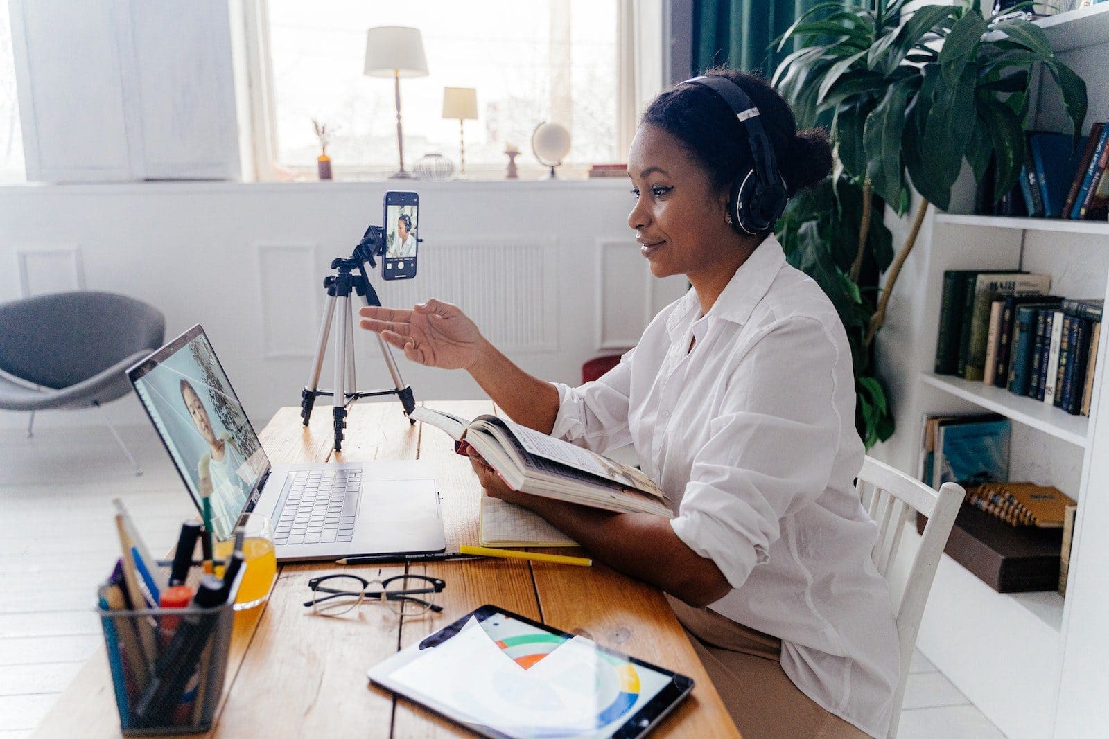 teaching online Woman Talking to a Person on Laptop