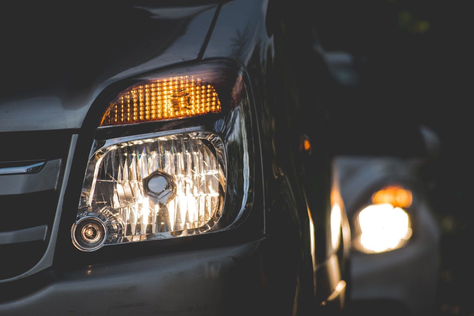 closeup photography of grey car aftermarket headlights
