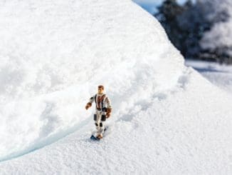a toy man is walking in the snow Winter Weather Workouts