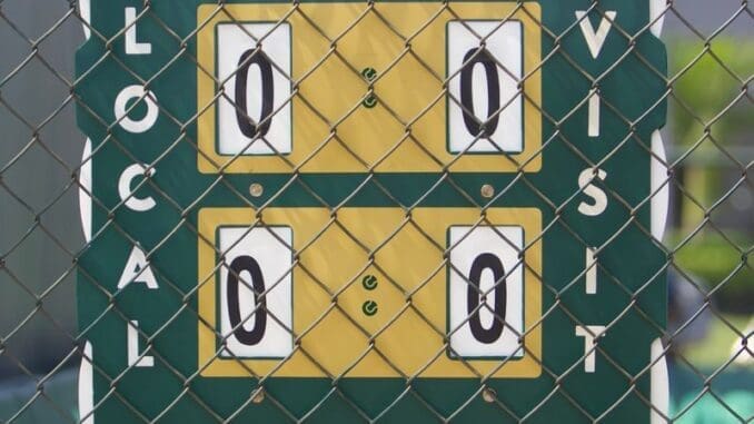 A tennis scoreboard with iron fence in Belas, Luanda, Angola captured from behind.